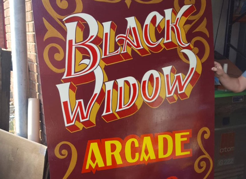 Black Widow Arcade Sign